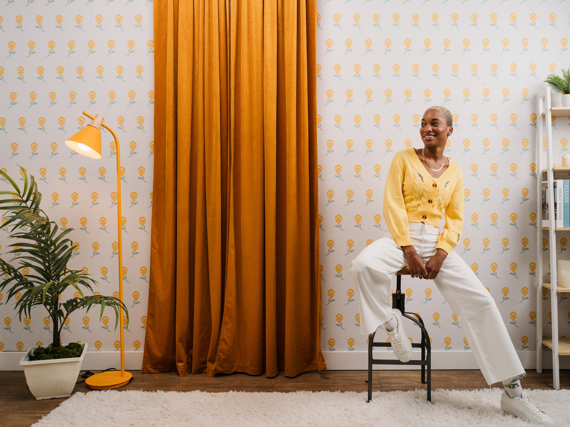 Dancing Iris wallpaper in yellow styled with a woman and modern interior - Huggleberry Hill