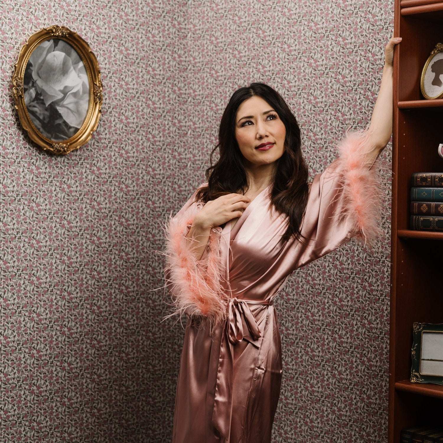 Pimpernel Patch wallpaper in pink styled in a vintage floral interior with a woman - Huggleberry Hill