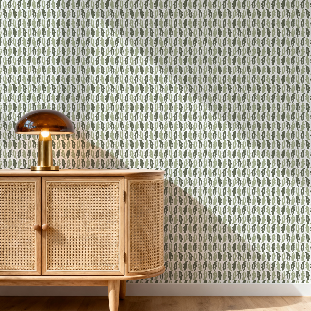 Woven wooden cabinet with a lamp against a patterned wallpaper.