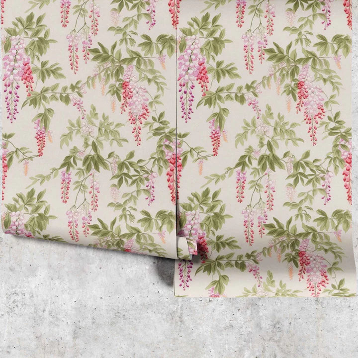 A wallpaper with pink wisteria flowers on a cream background