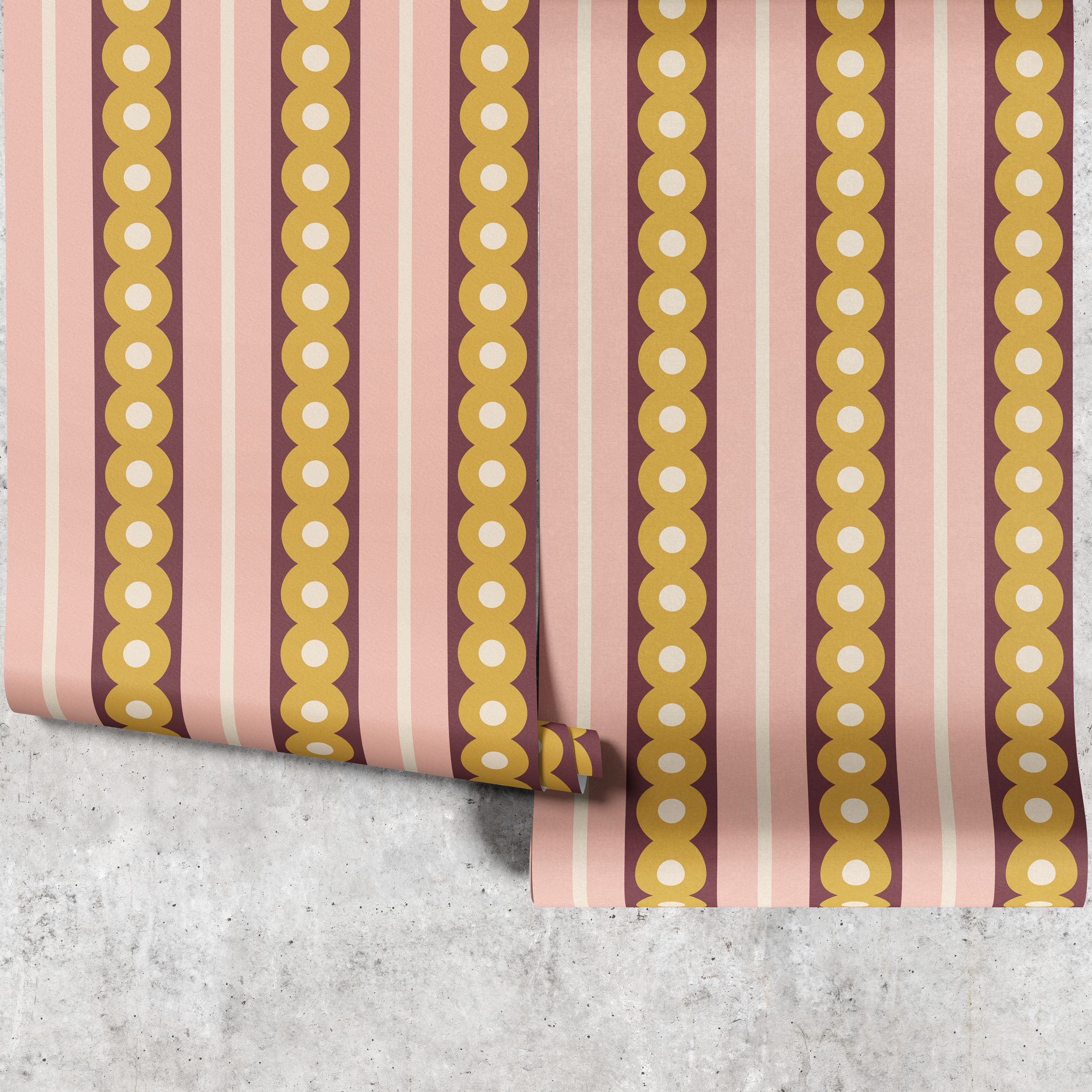 Two panels of midcentury wide stripe wallpaper in yellow, plum and pink hanging against a concrete wall