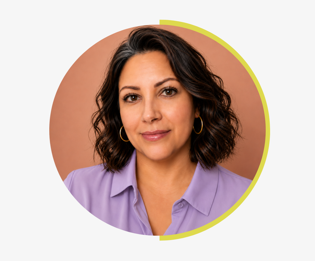 Circle profile picture of a the owner of Huggleberry Hill in a purple shirt against a brown background
