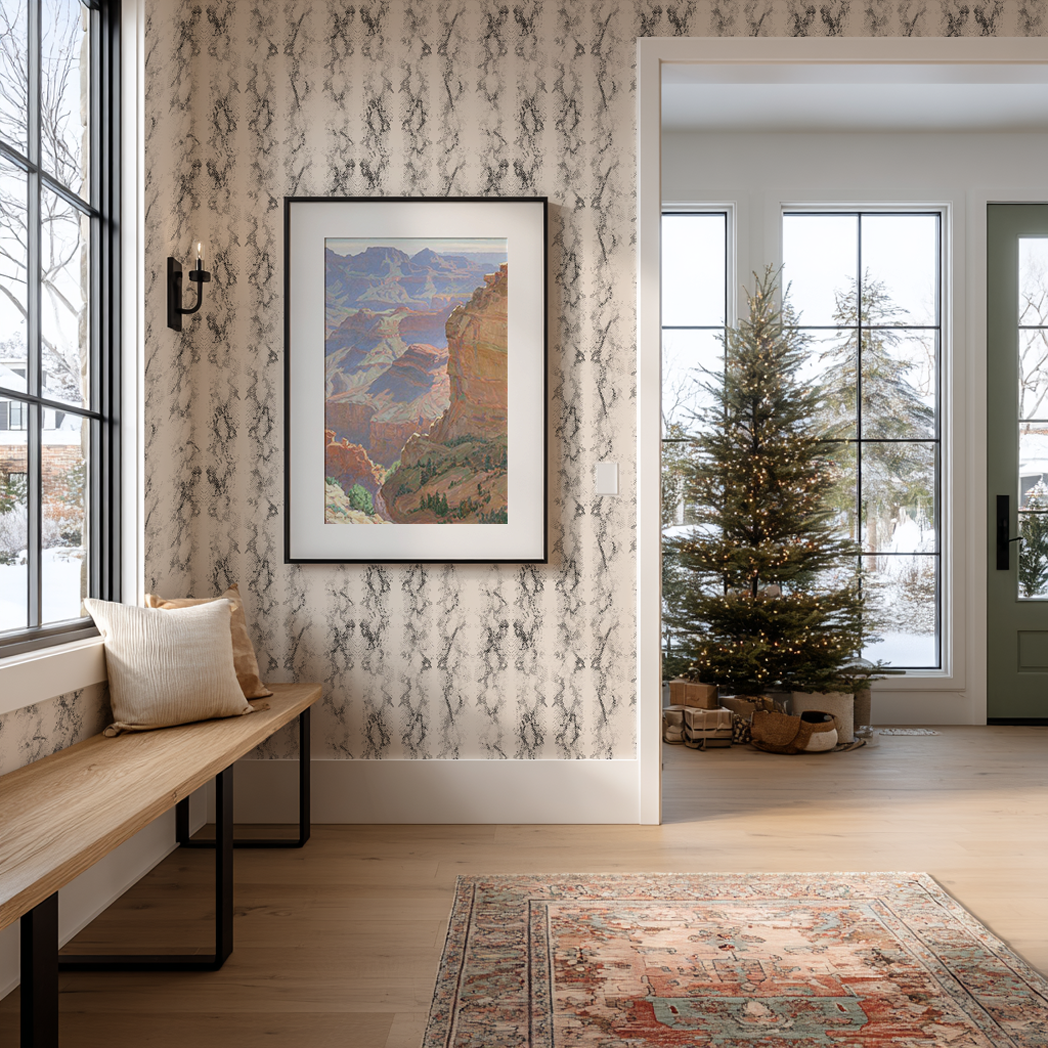 Warm entryway with wood bench and cream marbled wallpaper, styled for winter with a simple pine tree and natural light