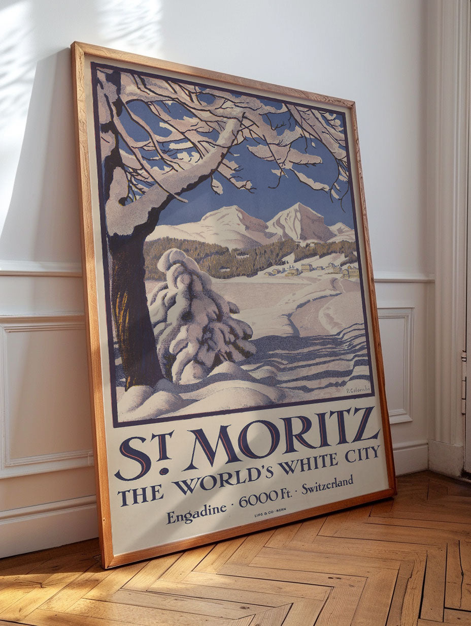 A large vintage travel poster in a simple wood frame leaning against a wall