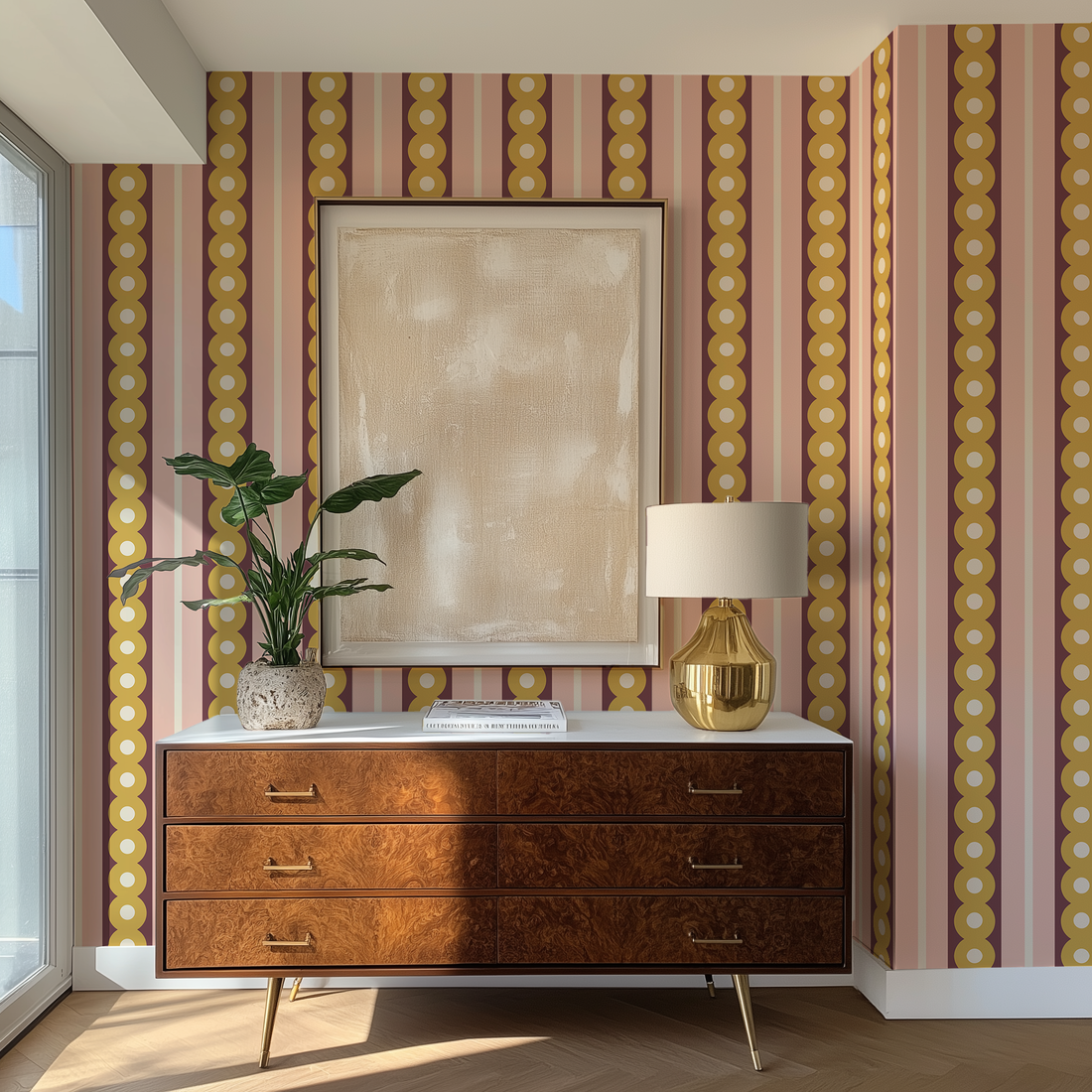 A dresser in the corner of an apartment living room with midcentury wide stripe wallpaper in yellow, plum and pink