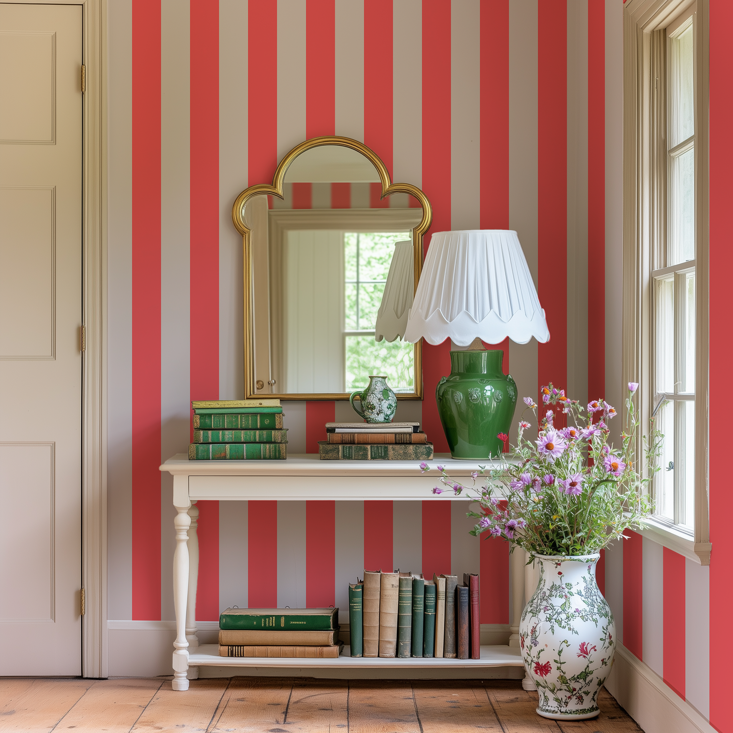 A farmhouse hallway with rustic wood flooring, vintage furniture and orange and beige striped wallpaper