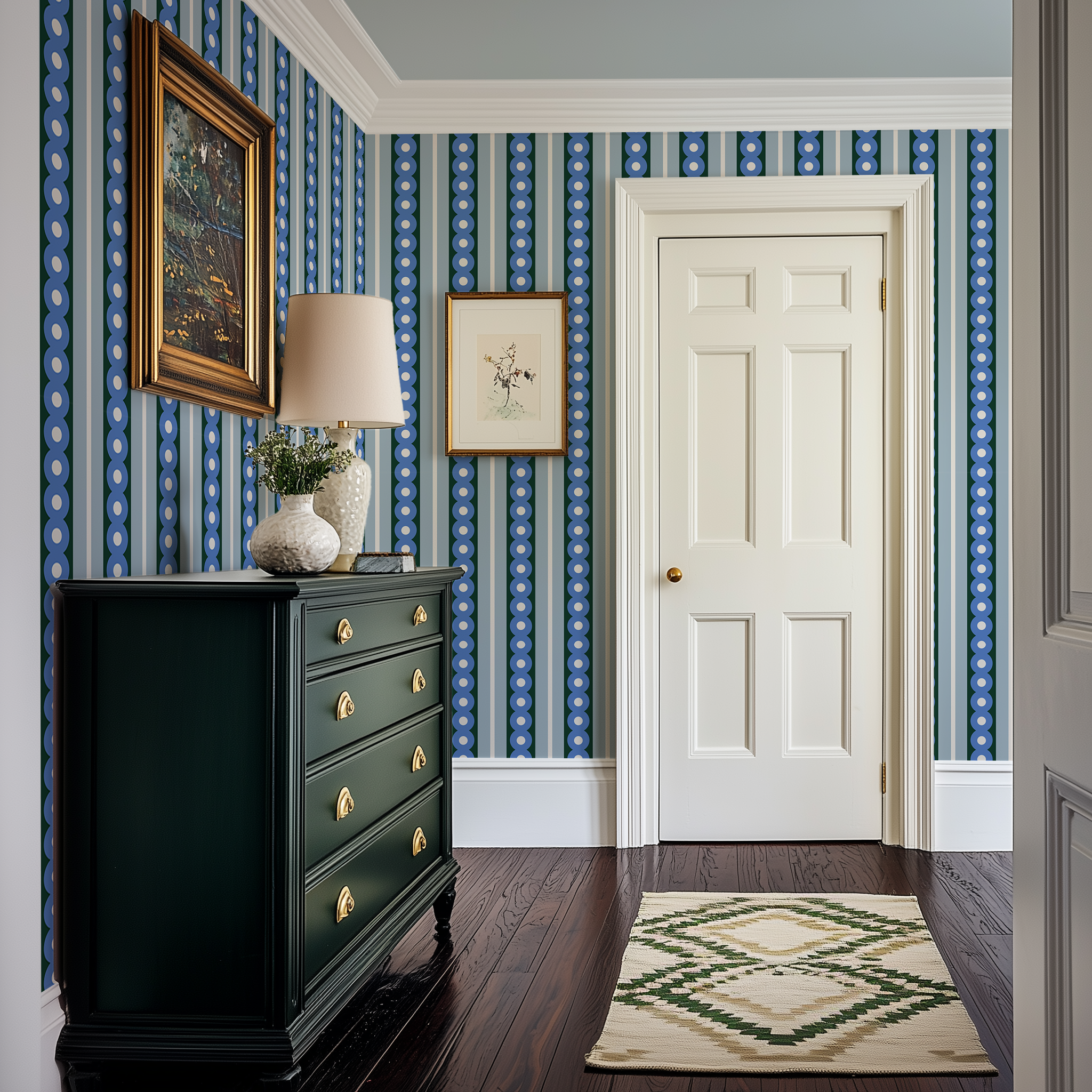 A hallway in a modern Victorian home with a midcentury wide stripe wallpaper in blue and green