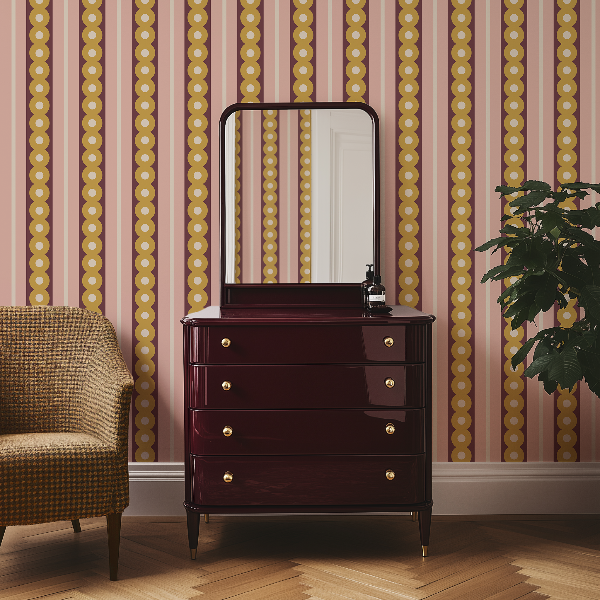 A glossy maroon bedroom dresser and tweed chair against a wall with midcentury wide stripe wallpaper in yellow, plum and pink