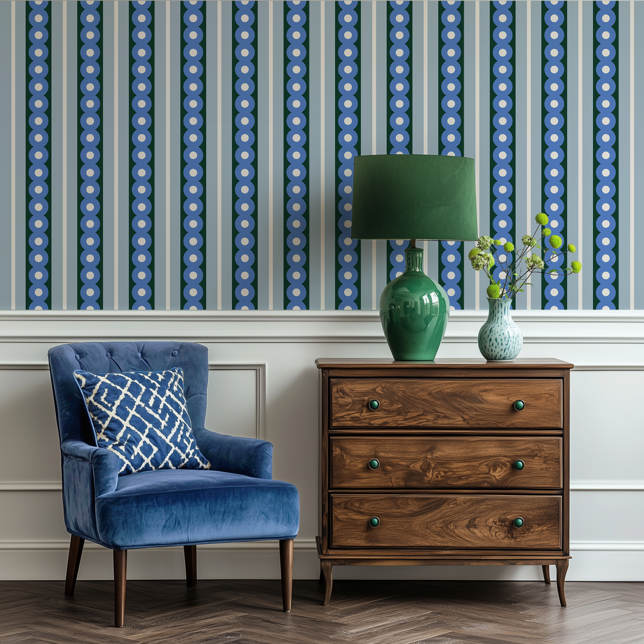 A velvet chair and antique drawers in a hallway with a midcentury wide stripe wallpaper in blue and green