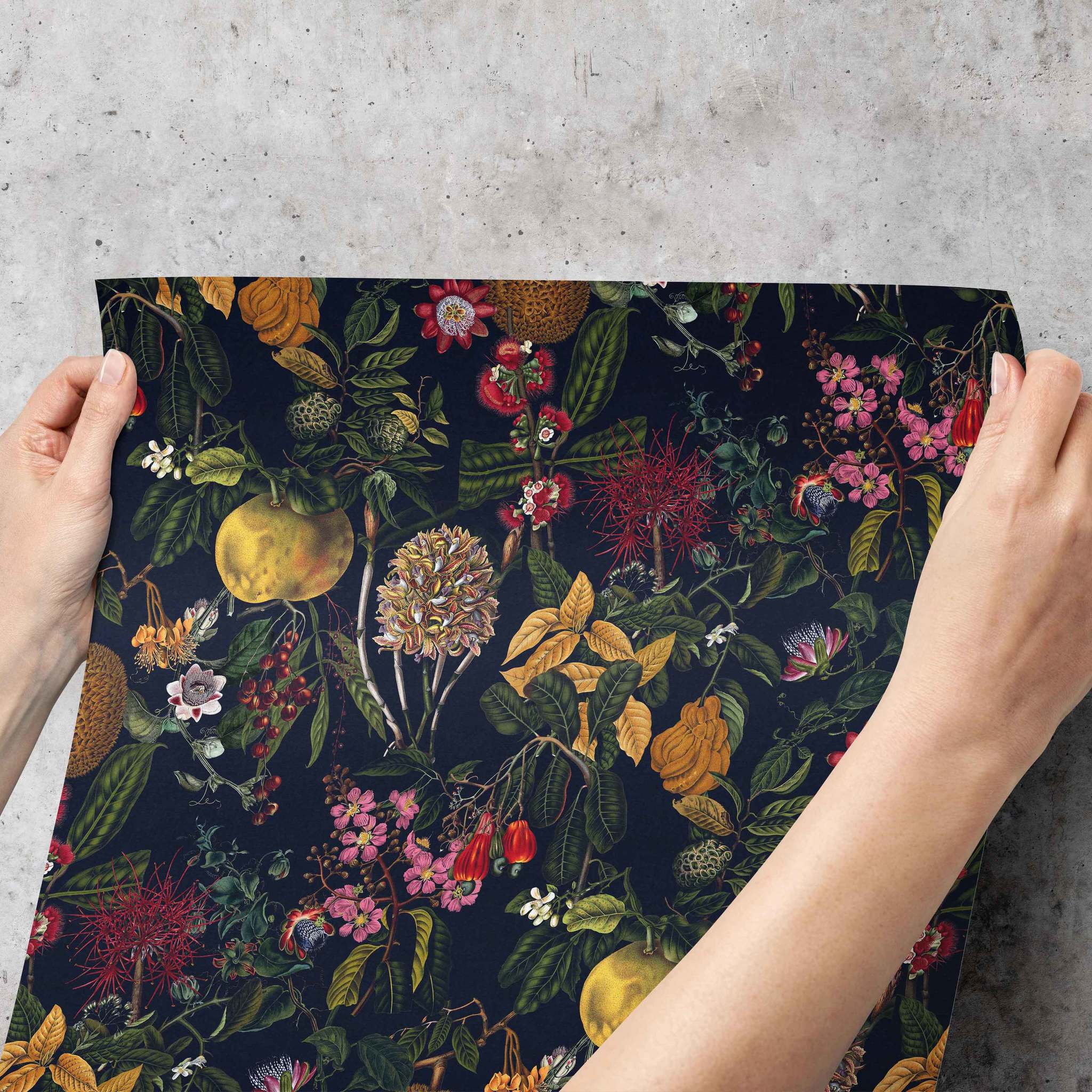 Applying patterned wallpaper to a wall – aligning and smoothing panel with hands for careful installation