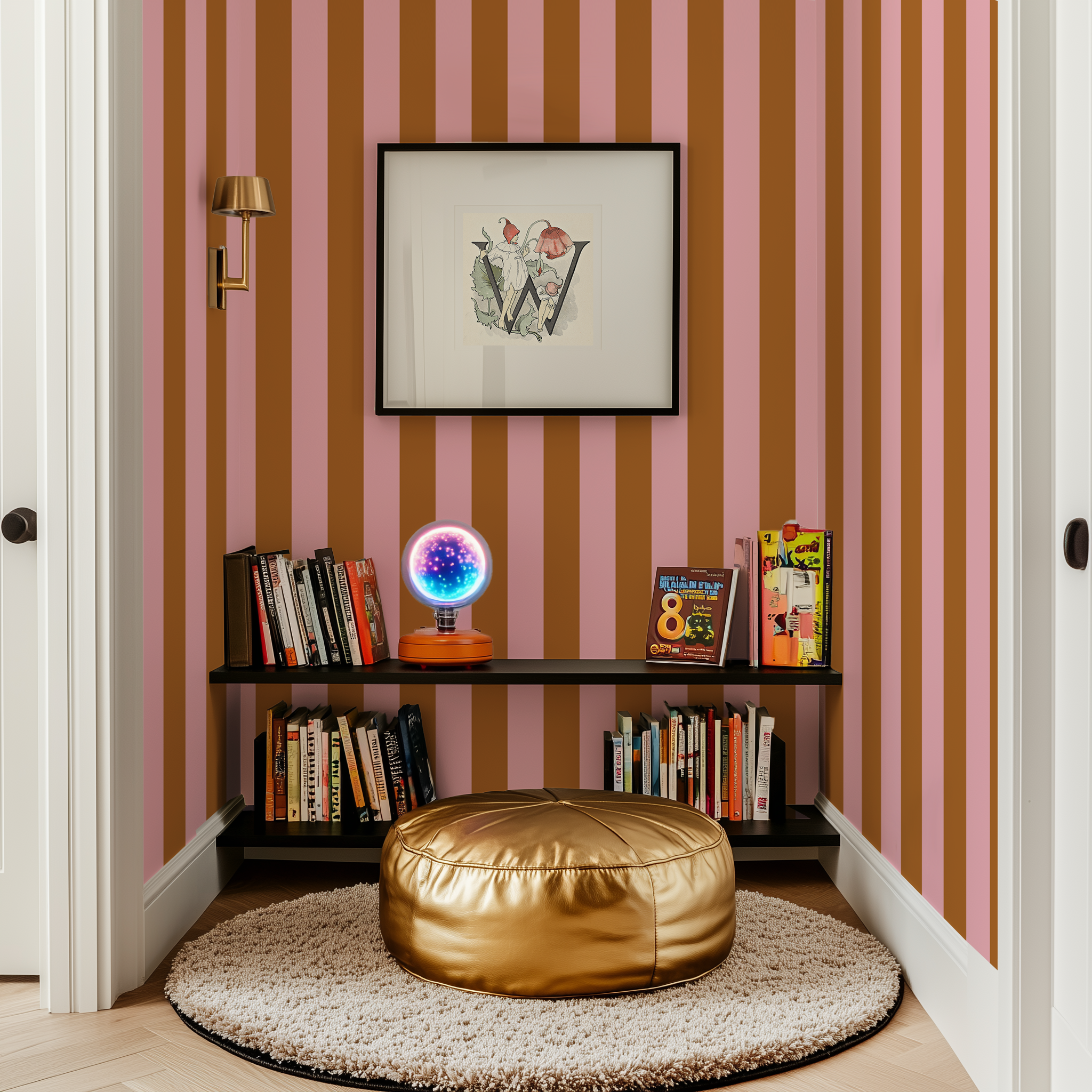 A reading nook in the corner of a kids bedroom with pink and gold wide stripe wallpaper 