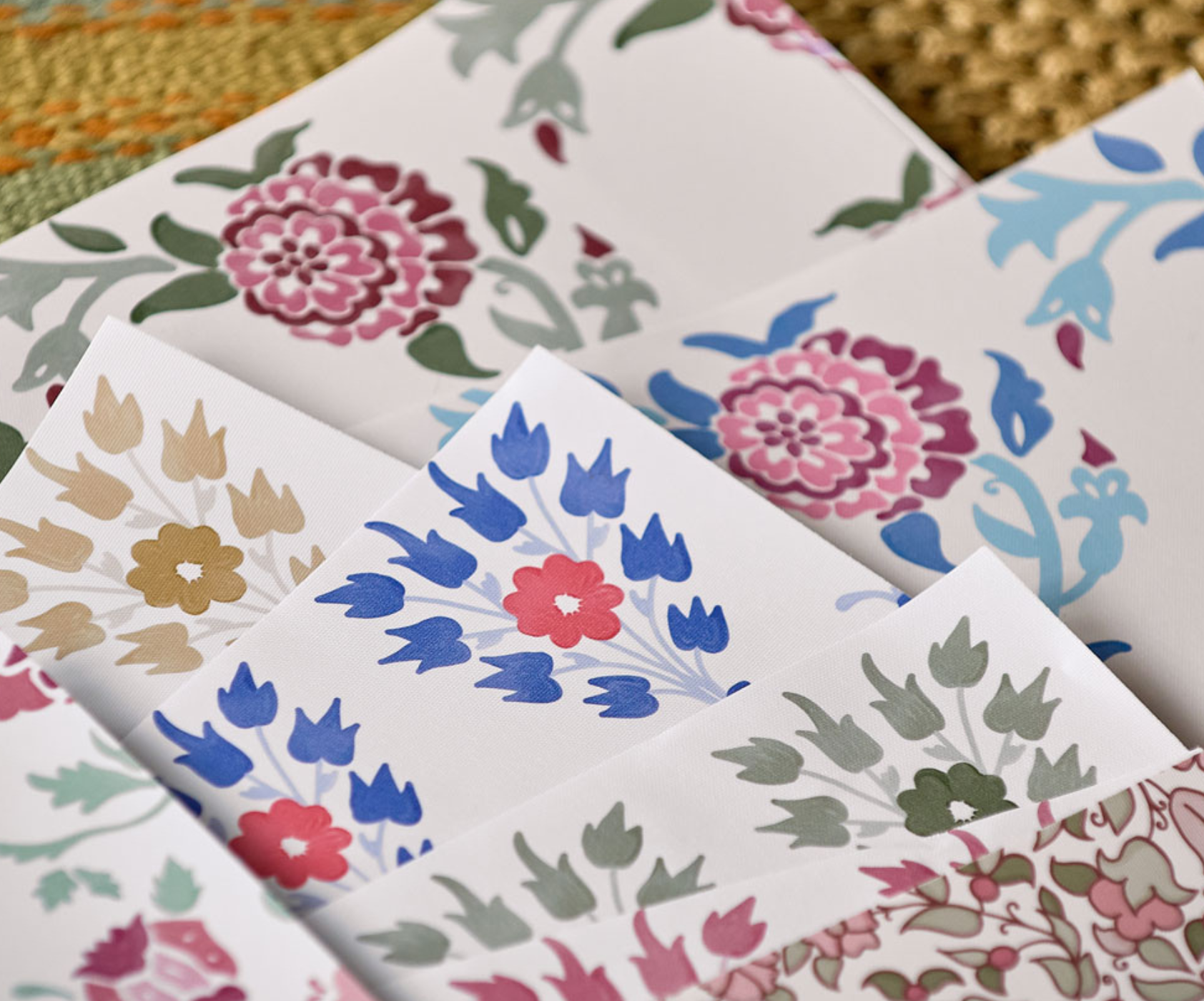 Large floral wallpaper samples showing multiple Huggleberry Hill designs and colorways