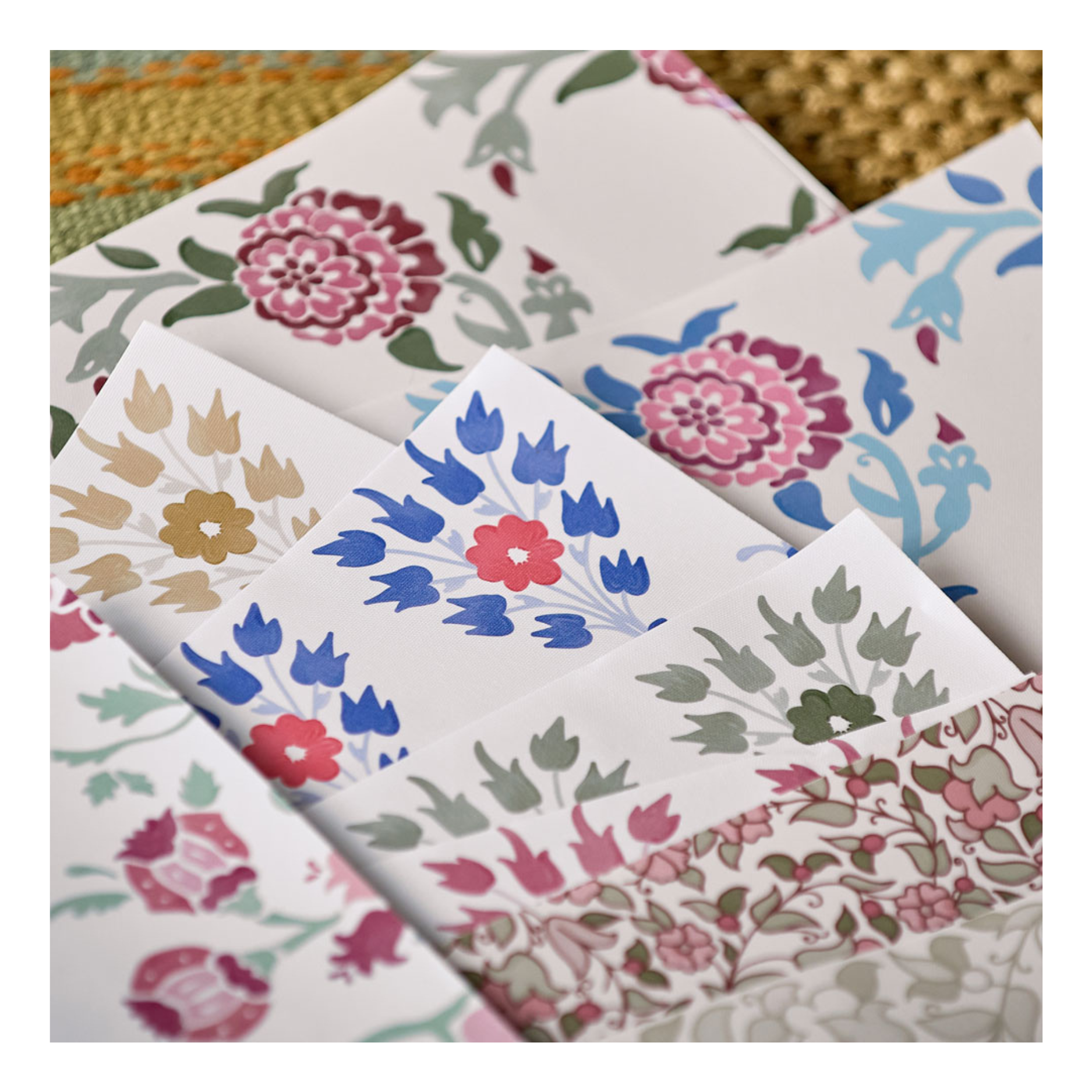 Large floral wallpaper samples showing multiple Huggleberry Hill designs and colorways