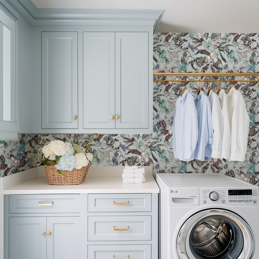 A beautiful chic powder blue laundry room with exotic orchid wallpaper