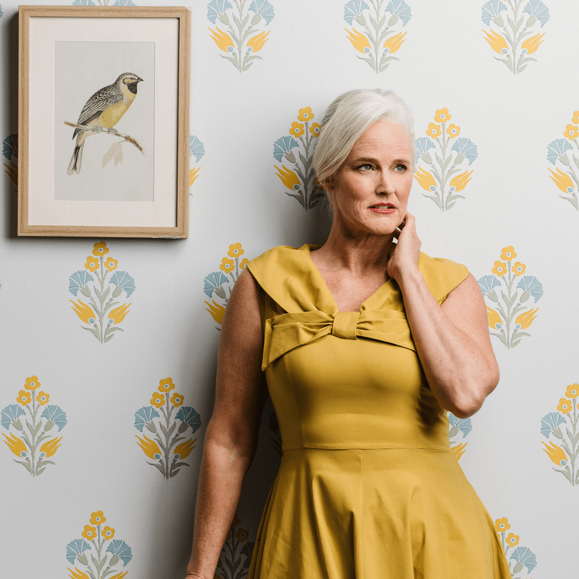 Lily Posy wallpaper in yellow styled with a woman in a lifestlye pose - Huggleberry Hill