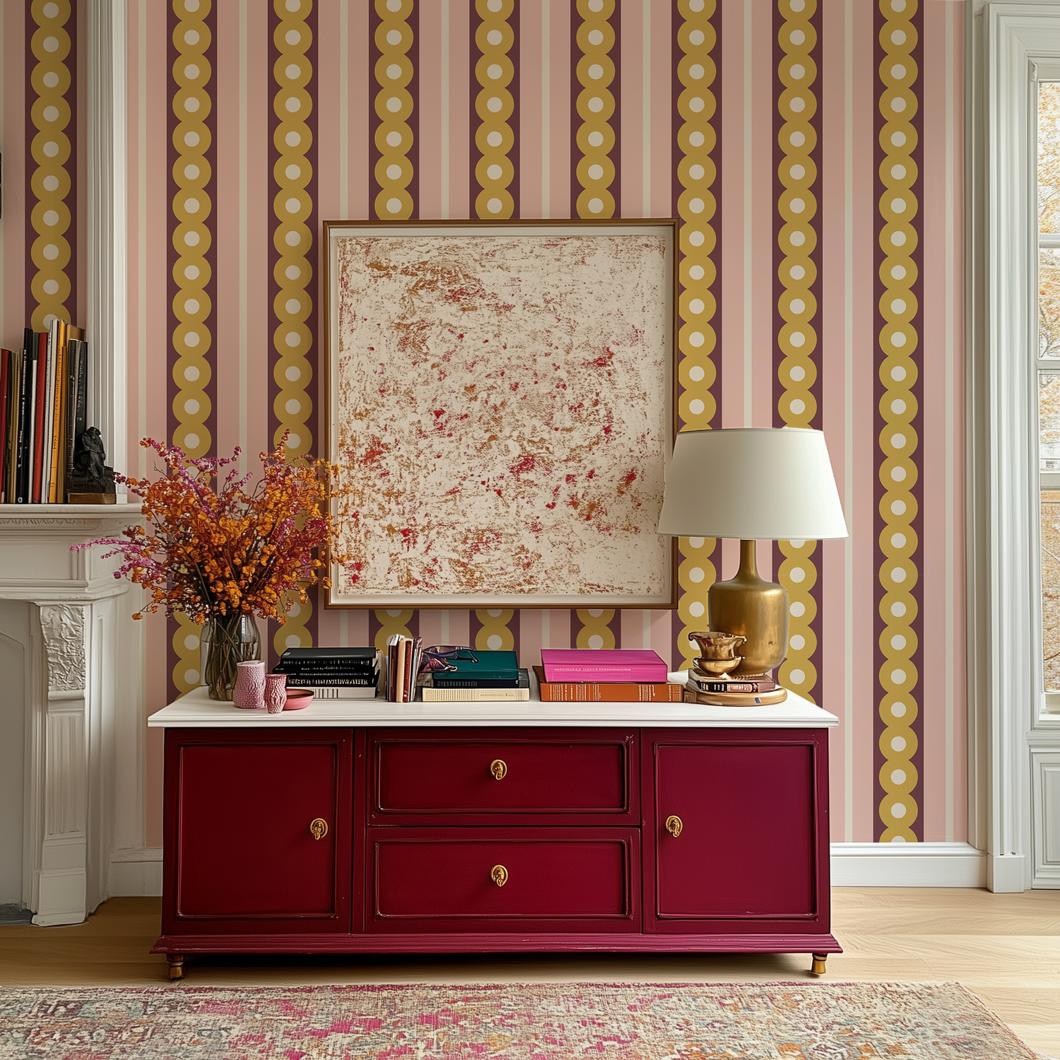 A red antique chest beside a fireplace in a Victorian living room with midcentury wide stripe wallpaper in yellow, plum and pink on the wall