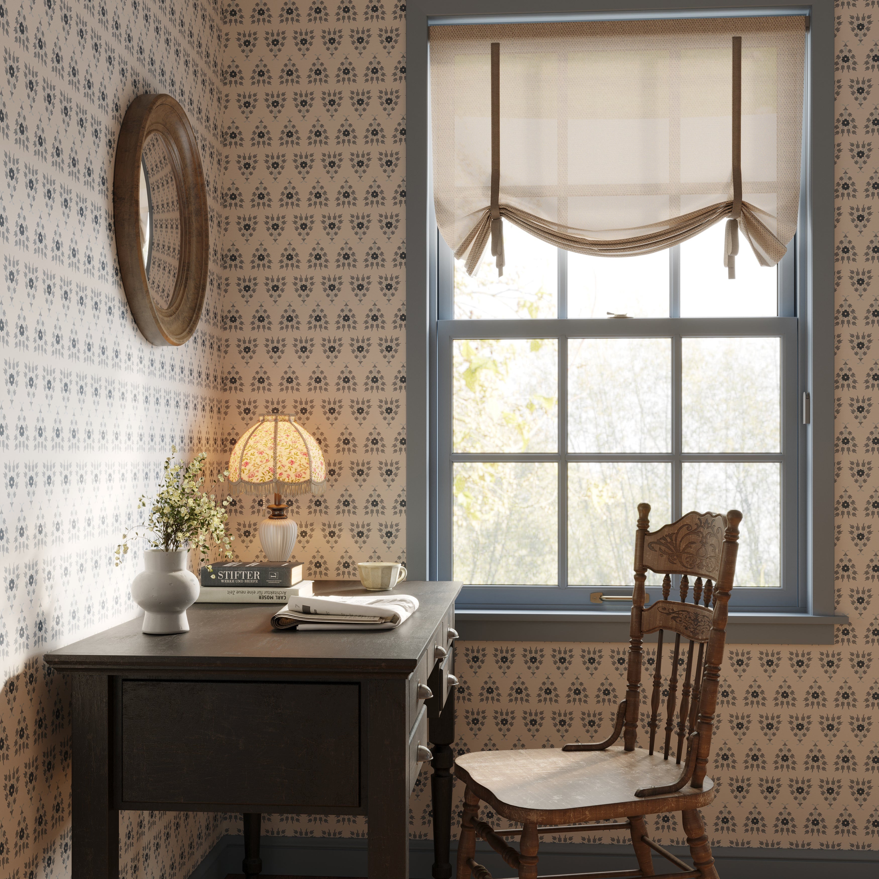 Nostalgic home office with patterned wallpaper, wooden desk, and chair.
